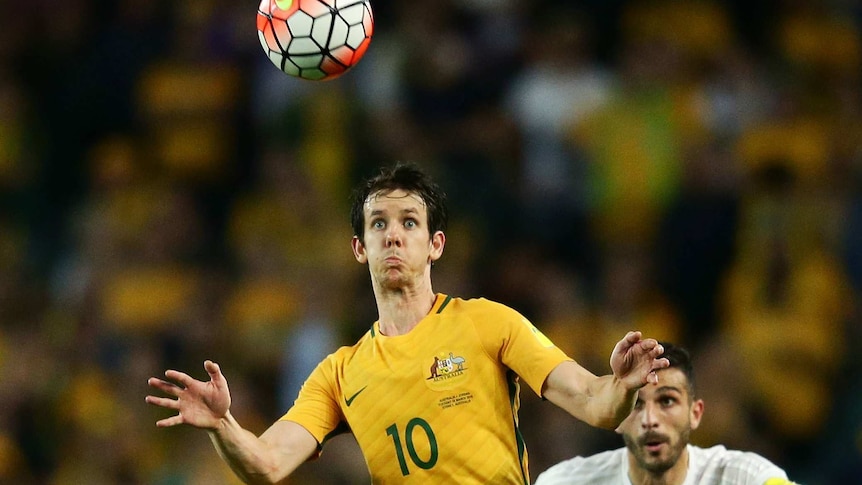 Robbie Kruse of the Socceroos controls the ball