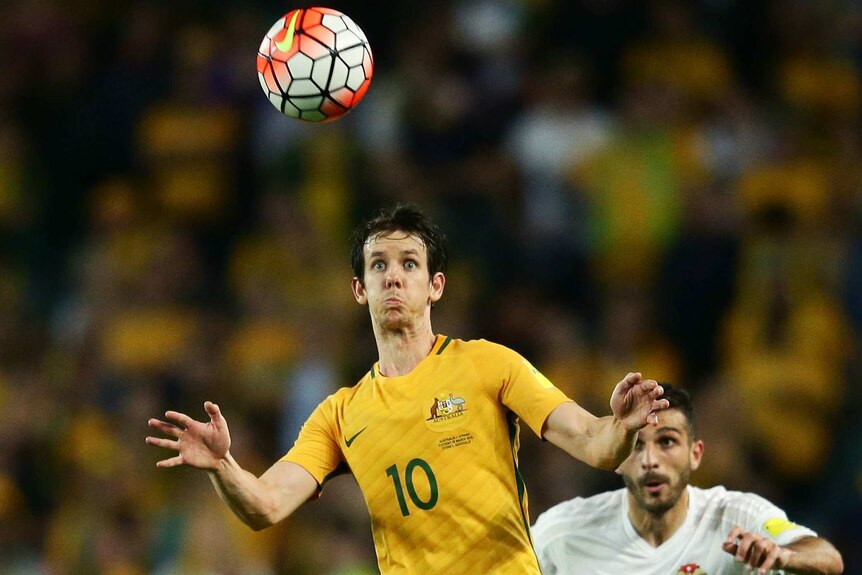 Robbie Kruse of the Socceroos controls the ball