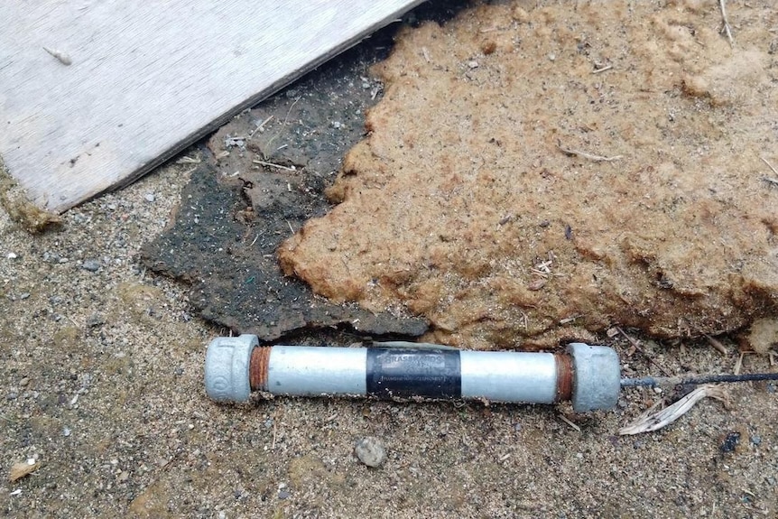 pipe bomb on the ground