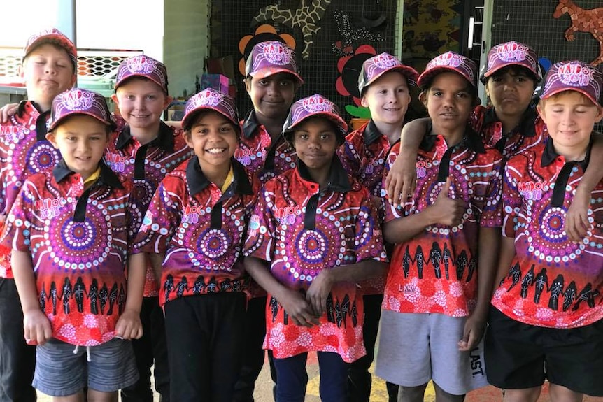 Children wearing colourful hats and shirts