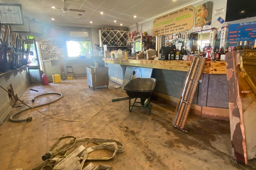 The inside of a business that has been badly damaged in a flood.