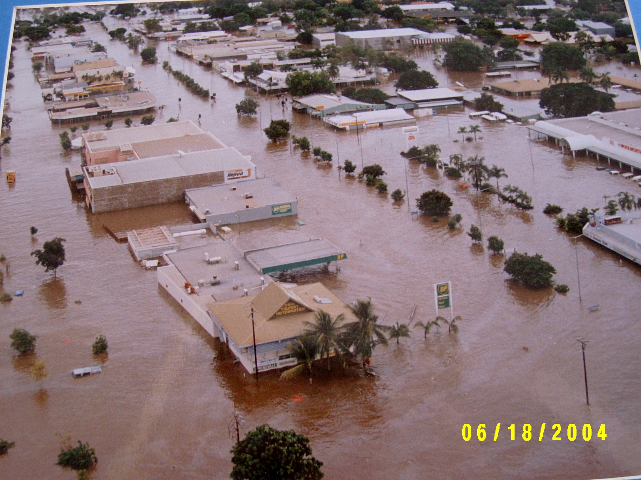 Houses amid flood water viewed from above