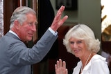 Prince Charles and Camilla wave to crowd outside hospital