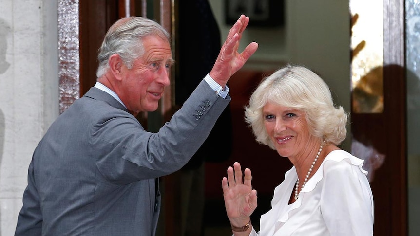 Prince Charles and Camilla wave to crowd outside hospital