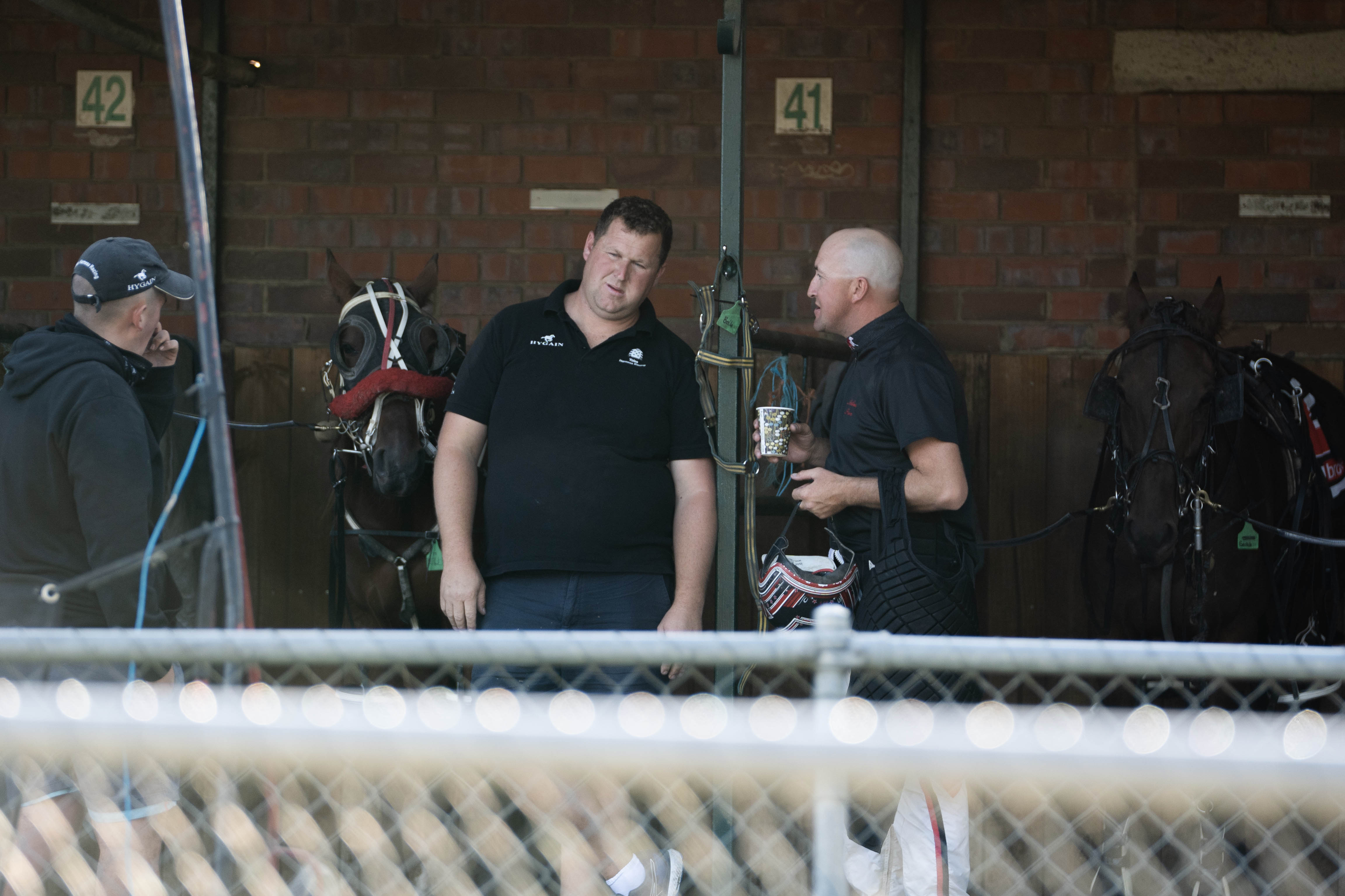 Ben Yole talks to someone at a horse stables.