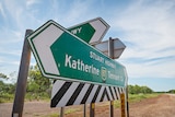 Road signage on the side of a highway intersection in the Northern Territory. 