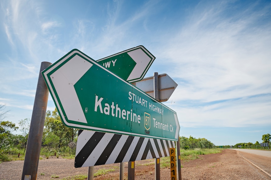 Road signage on the side of a highway intersection in the Northern Territory. 