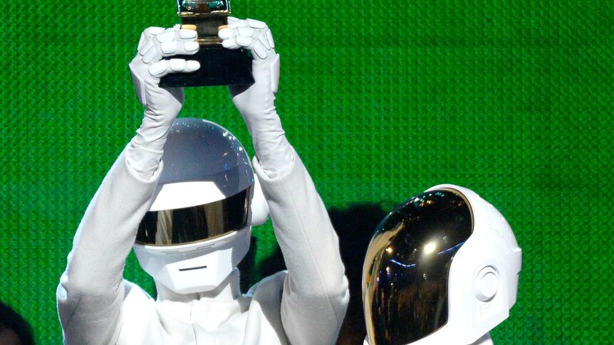 Daft Punk accept the Album of the Year award at the Grammys in Los Angeles.
