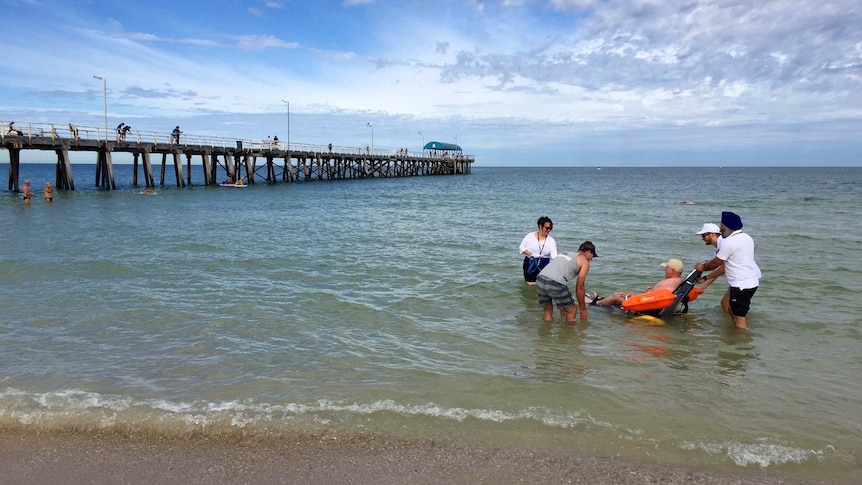 Wheelchair user takes a dip