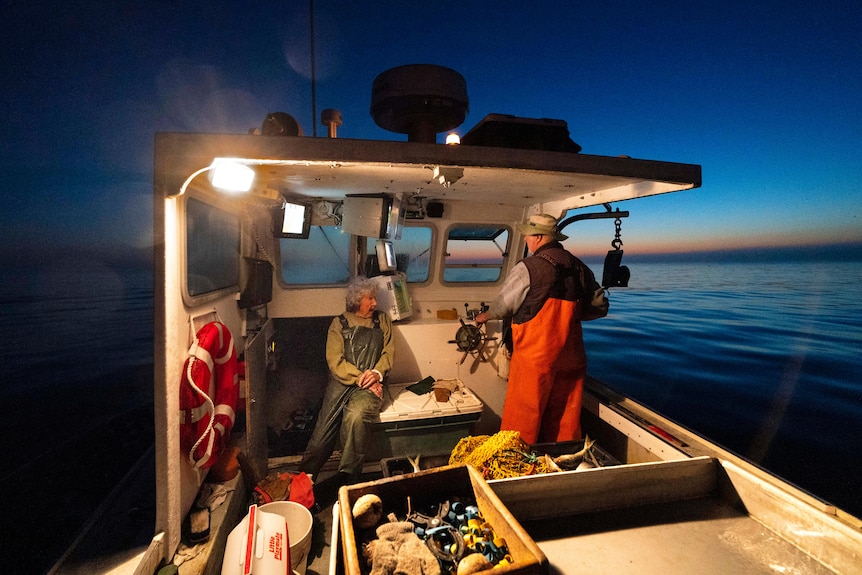 Mother and son on a lobster ship