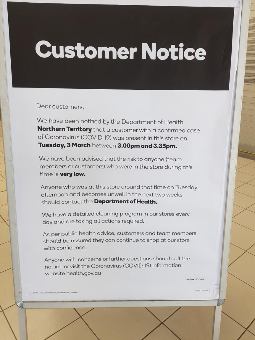 A Woolworths customer notice outside its Darwin City store