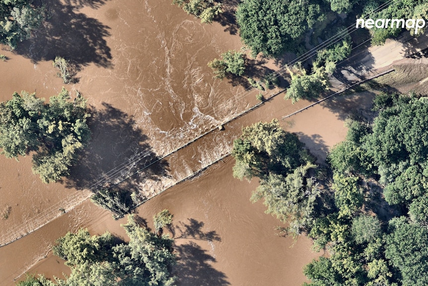 A birds eye view of flood water and trees.