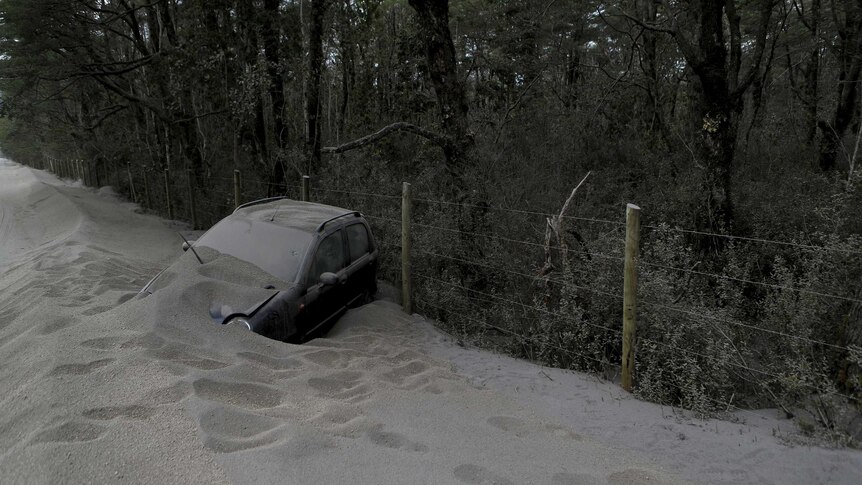 Chile volcano: A car lies covered with ashes from Calbuco Volcano at the road to Petrohue lake, in the vicinity of Puerto Montt city