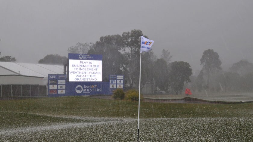 Hail engulfs the 18th green at Huntingdale at the end of the first day's play of the Masters
