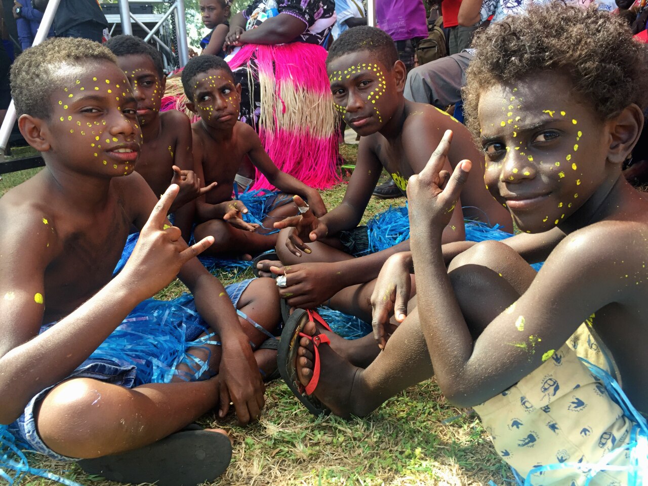 A group of children at the Bougainville Day celebrations in Port Moresby in 2019. Their faces are painted with yellow dots.
