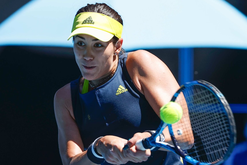 Garbine Muguruza plays a two-handed backhand at the Australian Open.