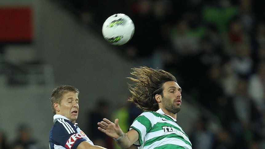Victory skipper Adrian Leijer and Celtic's Georgios Samaras contest a ball in the air at AAMI Park.