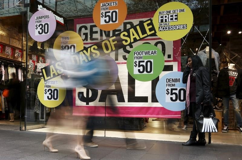 An image of a shop window advertising discounted clothes in Sydney