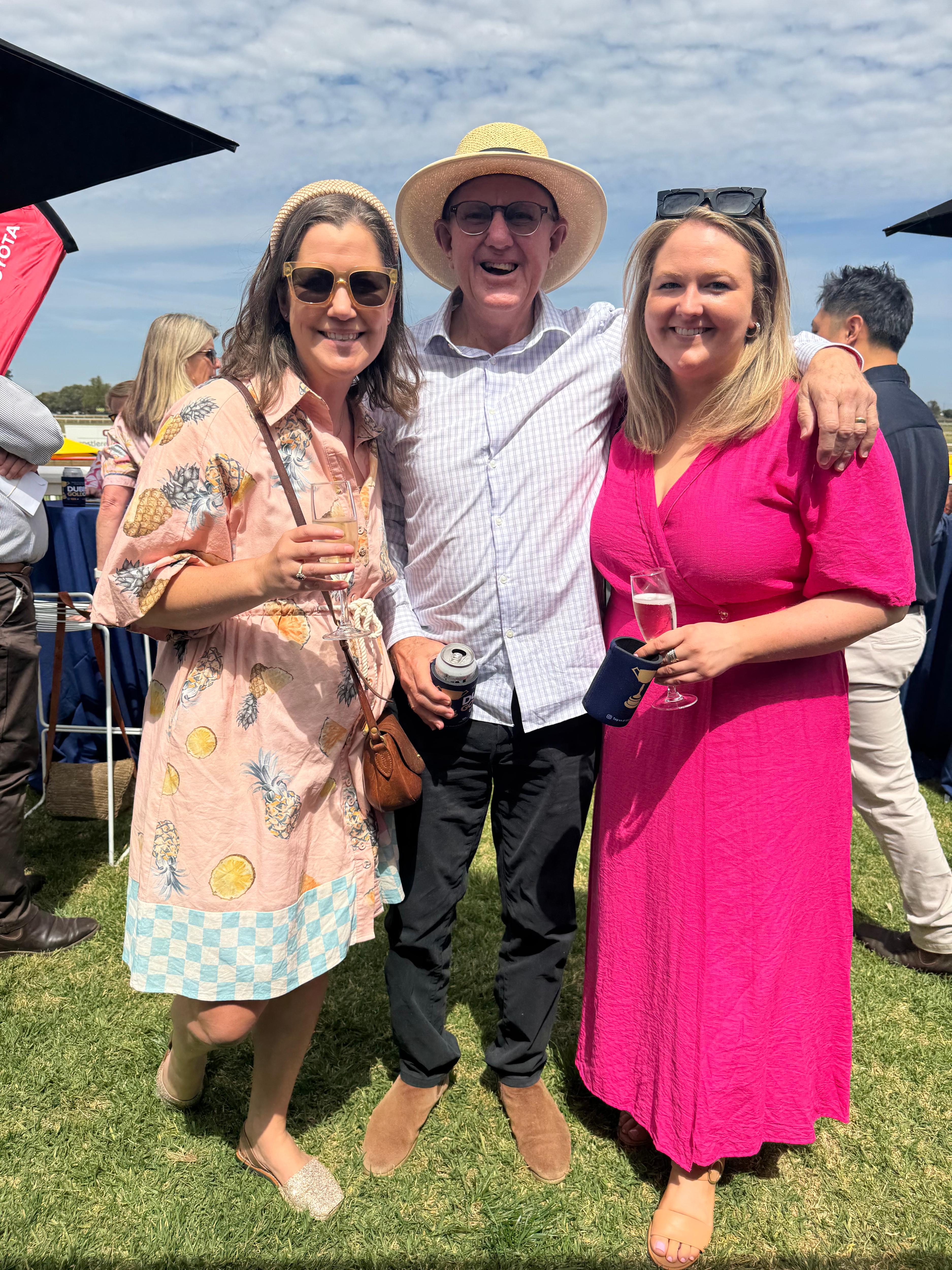 Geoff Mann, Jen McCutcheon and Zaarkacha Marlen outside at a horse-racing event.