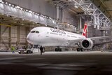 Qantas's first Dreamliner 787-9 sits in a factory.