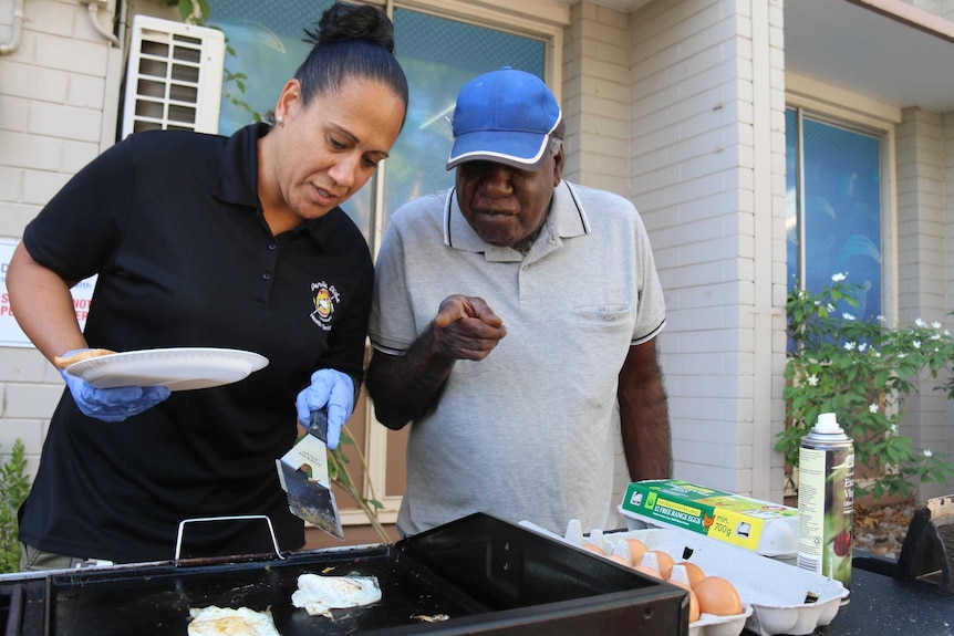 Tracey Thompson flips an egg for a hungry customer.