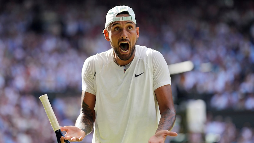 A wide-eyed Nick Kyrgios shouts up into the stands after a point in his Wimbledon men's singles final. 