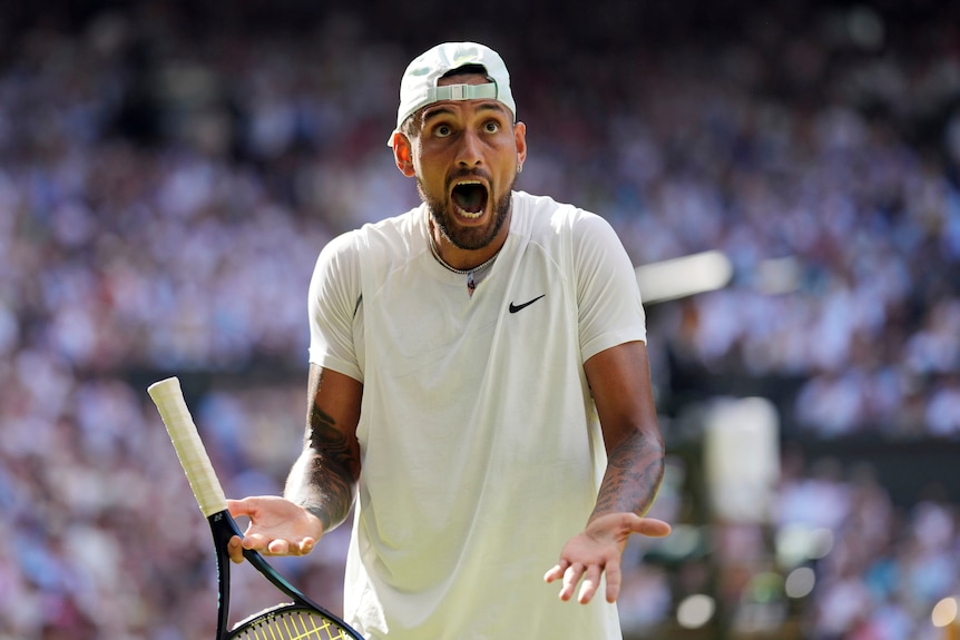 A wide-eyed Nick Kyrgios shouts up into the stands after a point in his Wimbledon men's singles final. 