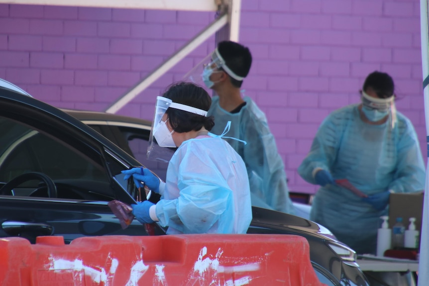 Medical staff wearing PPE at a COVID testing clinic in Perth.