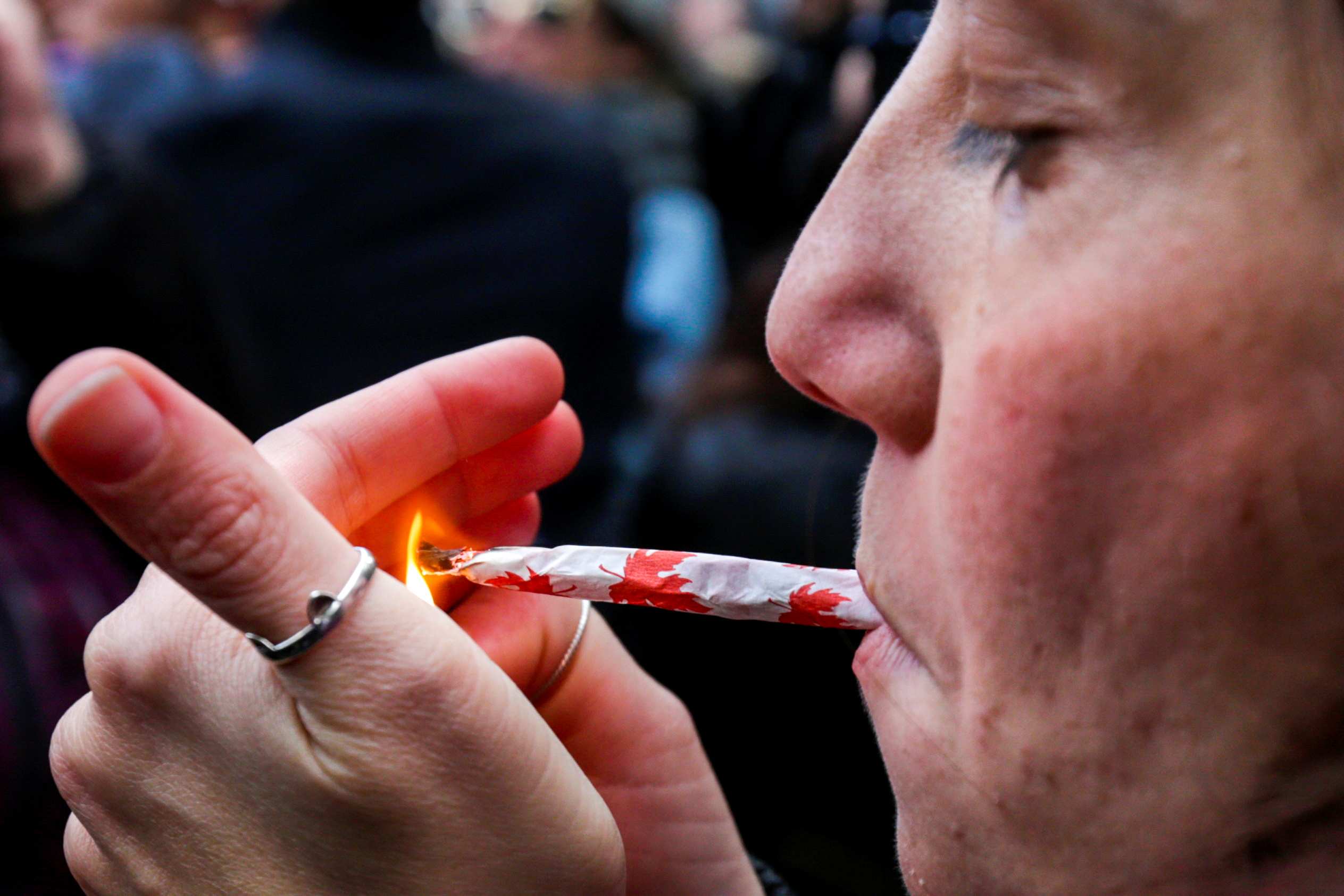 A woman smokes a joint on the day Canada legalises recreational marijuana at Trinity Bellwoods Park, in Toronto.