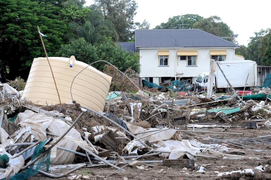 A water tank lays amongst the debris showing the flood devastation in the town of Grantham.