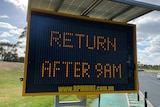 A road safety screen reads 'RETURN AFTER 9AM'.