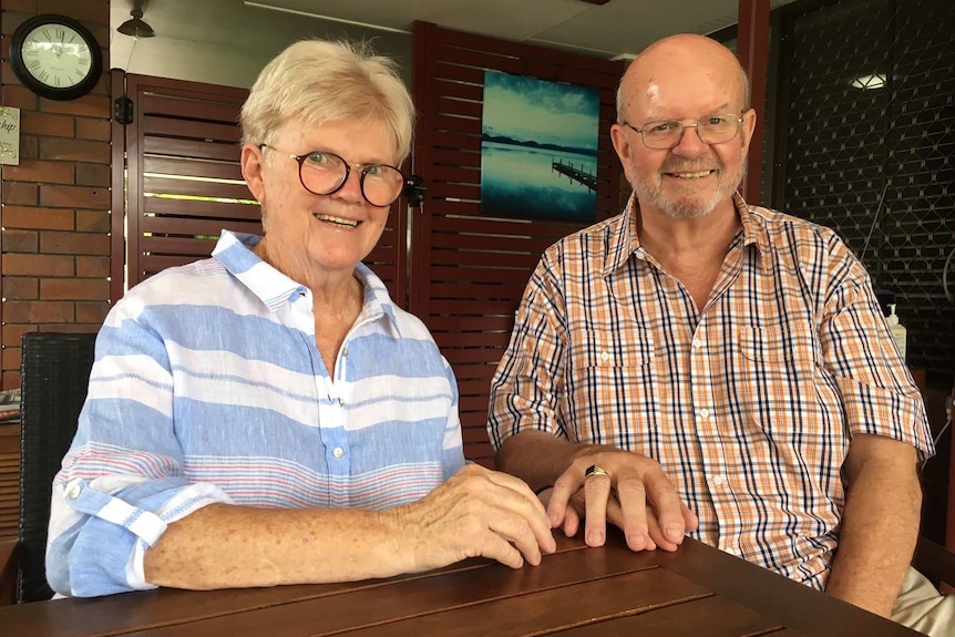 David Warner, 69, and his wife Elizabeth sit at an outdoor table.