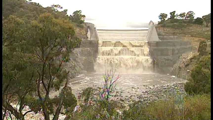 Googong Dam overflowing in December after heavy summer rain. The dam is currently at 100 per cent capacity.