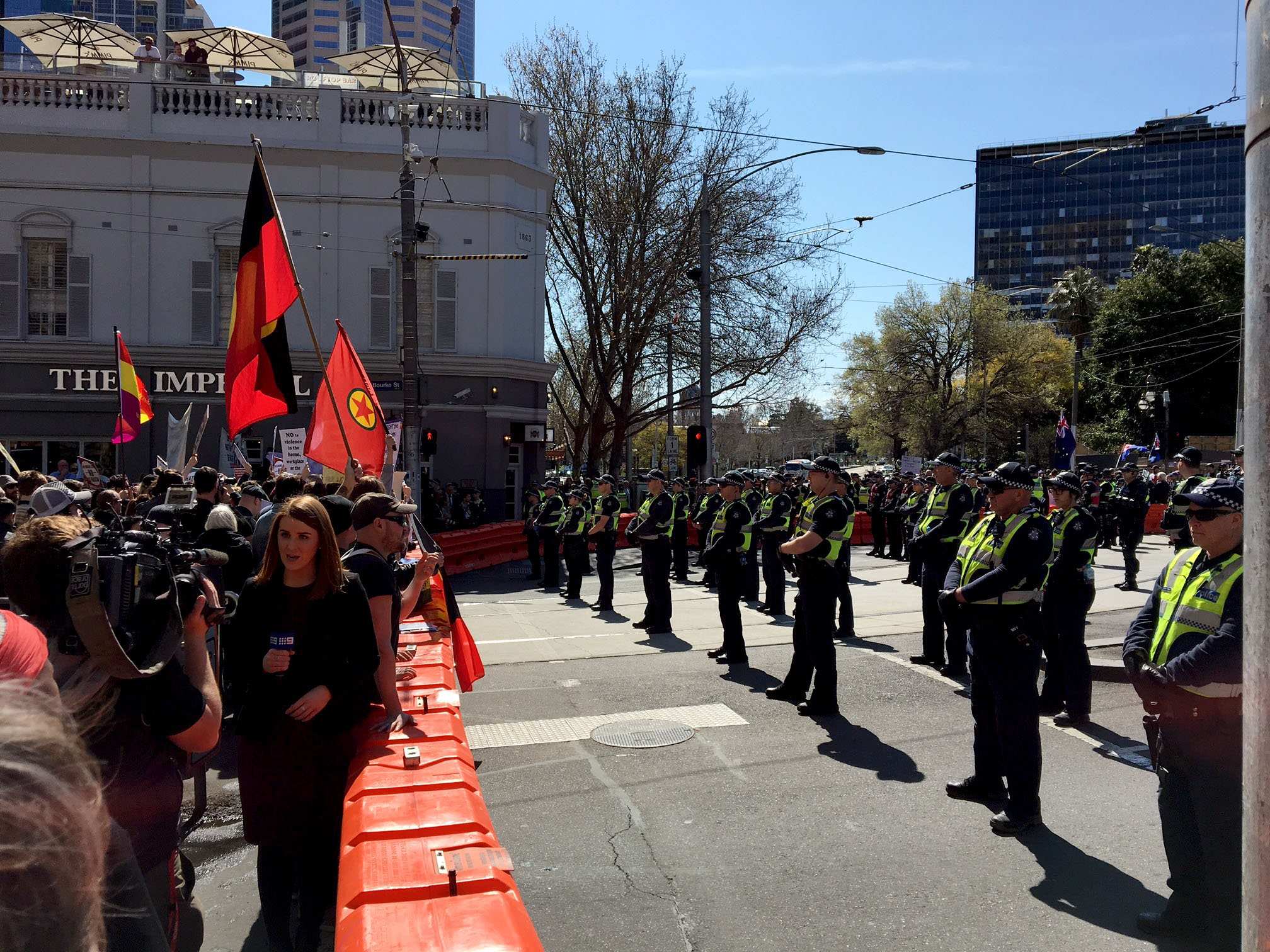 Rival groups face off in Melbourne as police test new antimask laws