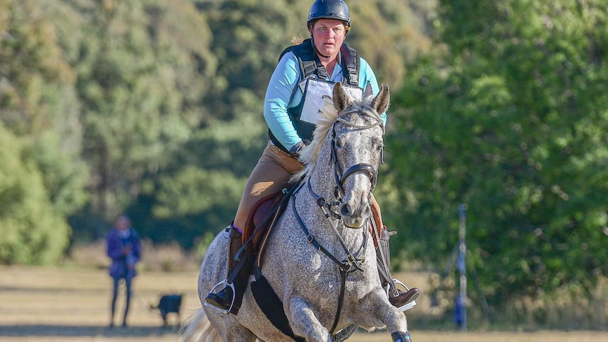 Felicity Fraser on a horse mid air over a jump