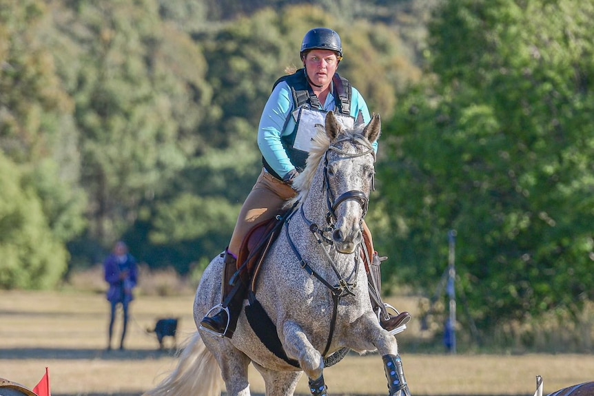 Felicity Fraser on a horse mid air over a jump