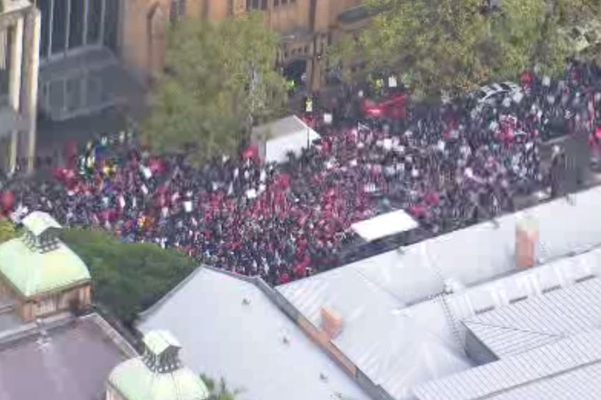 arial footage of people gathered outside a building