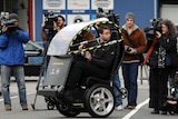 Rickshaw or car? The electric two-seat prototype vehicle is unveiled in New York.