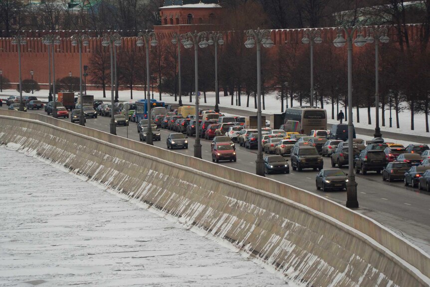 Traffic at a standstill alongside a frozen river in Moscow