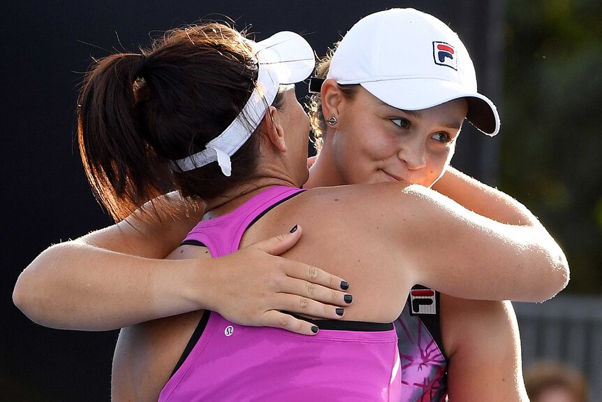 Ashleigh Barty and Casey Dellacqua celebrate a win at the Australian Open