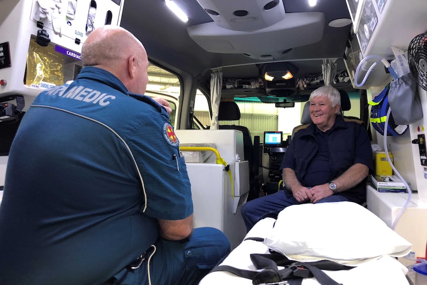 Danny Fowler in an ambulance talking to a paramedic