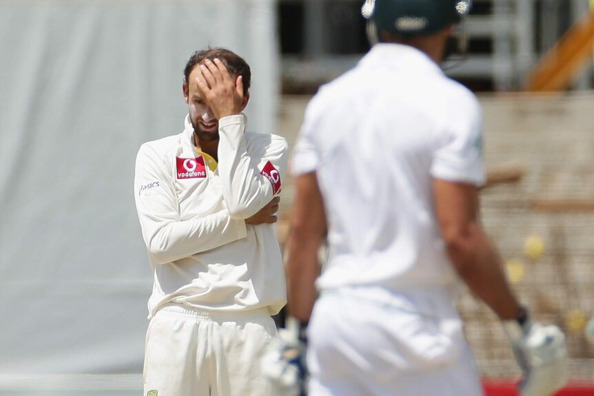 Frustrations soar... Nathan Lyon shows his anguish while bowling to Faf du Plessis.