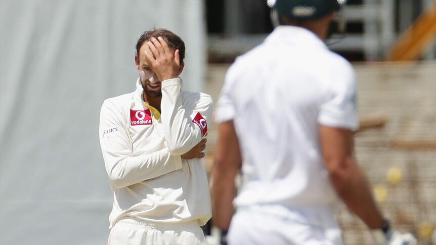 Frustrations soar... Nathan Lyon shows his anguish while bowling to Faf du Plessis.