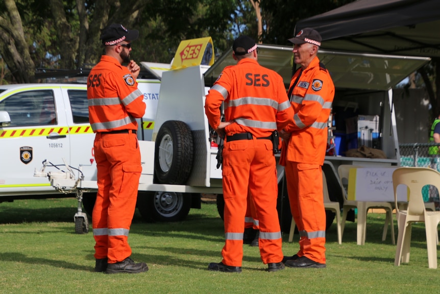 Three SES crew members in orange uniform