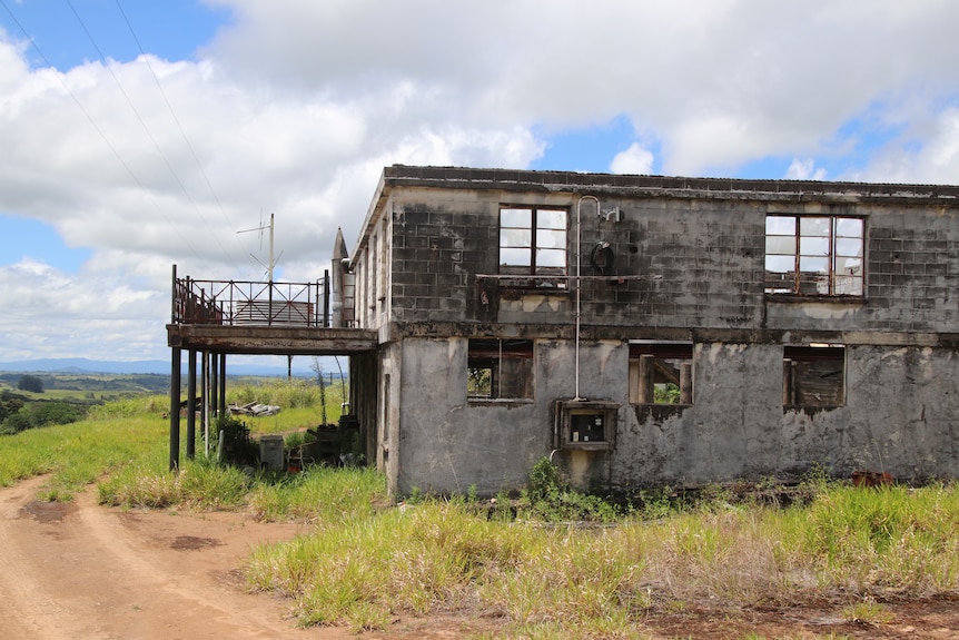 concrete ruins in a grass paddock