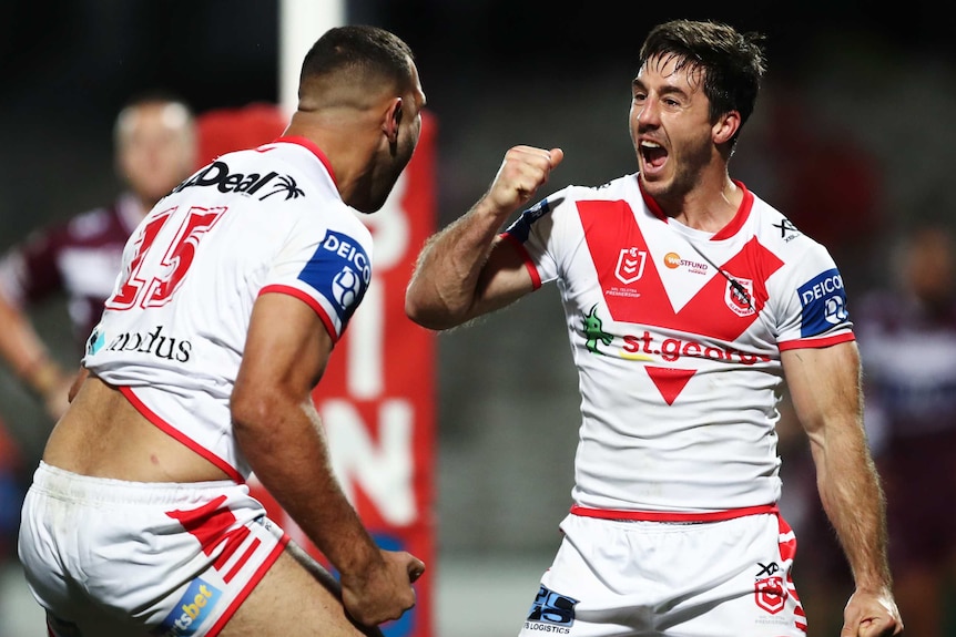 Josh Kerr and Ben Hunt pump their fists and scream in each other's direction