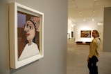 An art lover walks past Picasso's La Coiffure at the launch of Picasso and His Collection at GoMA.