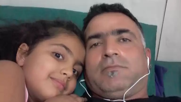 Sam Nemati (R) with his daughter Aisya.