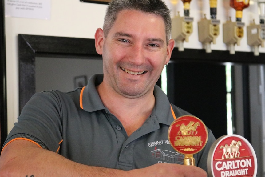 Kahl Murphy, a publican in Caramut, stands behind the bar