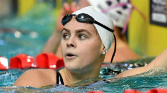 Shayna Jack looks over her shoulder after completing a race in the pool